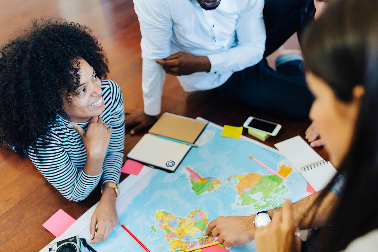 group of travel insurance coworkers in a planning meeting